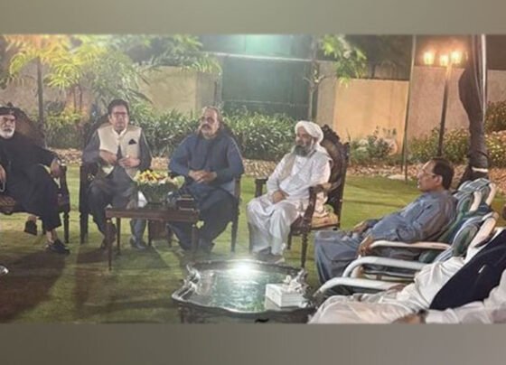Government and opposition members are sitting together.