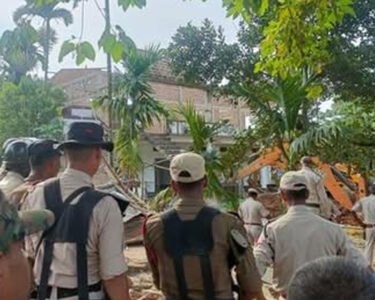Houses being bulldozed under Modi's supervision