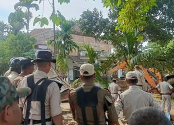 Houses being bulldozed under Modi's supervision